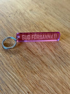 Nyckelring | “Gud förbannat” i Rosa spegelplast - Expresspresenter.se