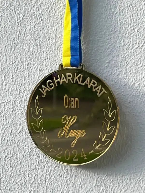 Medalj | 0:an - Express - presenter