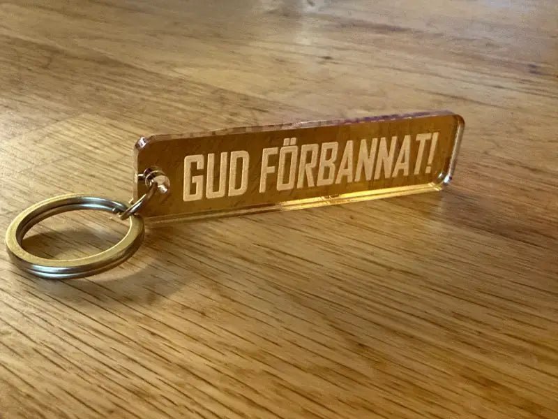 Nyckelring | “Gud förbannat” i Guld spegelplast - Engwek.se