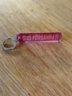 Nyckelring | “Gud förbannat” i Rosa spegelplast - Engwek.se