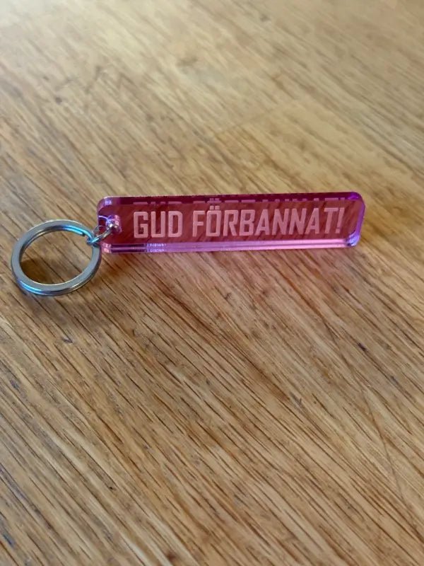 Nyckelring | “Gud förbannat” i Rosa spegelplast - Engwek.se