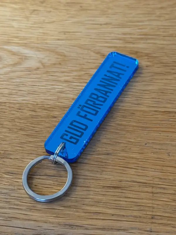 Nyckelring | “Gud förbannat” i Blå spegelplast - ByEngwek