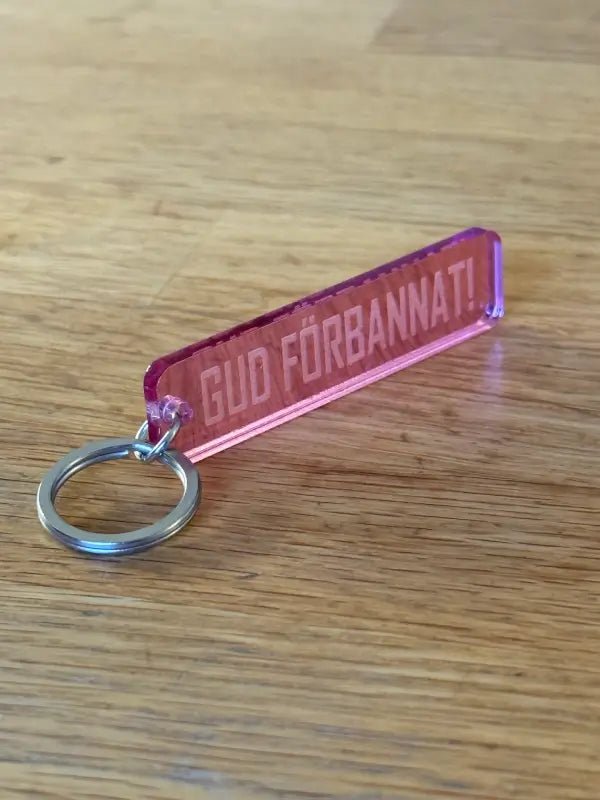 Nyckelring | “Gud förbannat” i Rosa spegelplast - ByEngwek