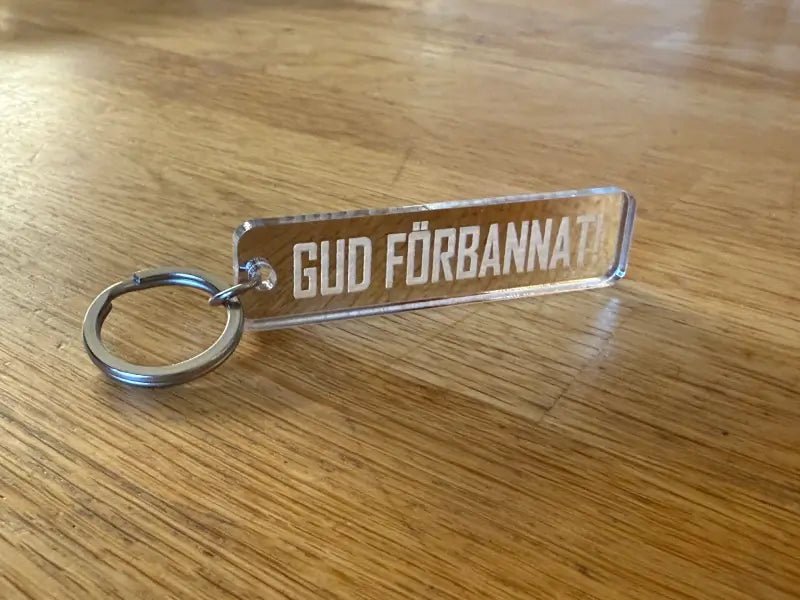 Nyckelring | “Gud förbannat” i Silver spegelplast - ByEngwek